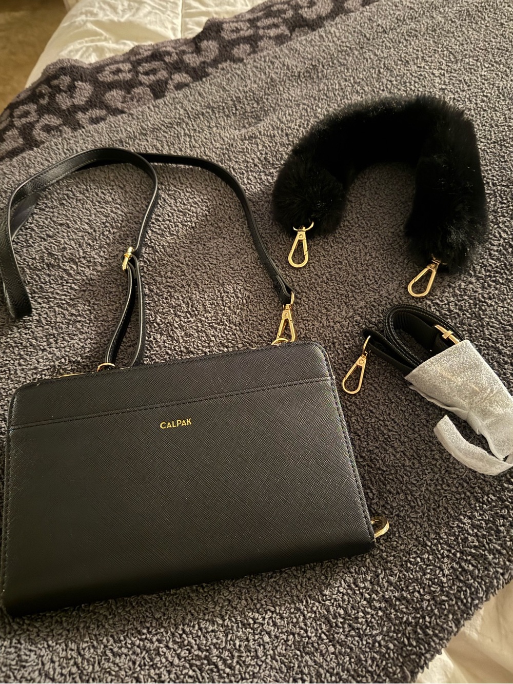Calpak Black Crossbody Travel Wallet with Gold Hardware and Detachable Fur Strap